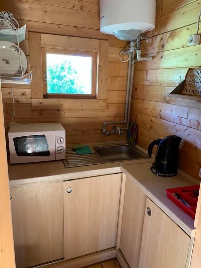 Лоджи Tranquil Log Cabin Retreat in Šventoji Швянтойи